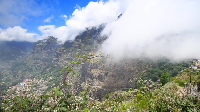 Clouds over the mountains on Madeira island at the Curral das Freiras or Valley of the Nuns.