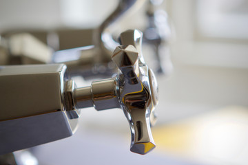 Traditional  chrome bath taps abstract angle