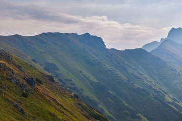 Naklejka premium Tourists walking along the ridges of the mountains in the Tatras