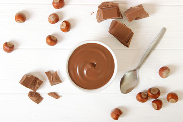 chocolate cream on a colored background top view. chocolate butter, chocolate paste.