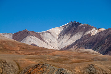 Russia. Altai. Kurai ridge. Multicolor brown and yellow shades of the mountains.
