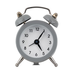 A gray clock with an alarm clock on a white background shows the arrows five hours five minutes or seventeen hours five minutes