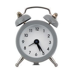 A gray clock with an alarm clock on a white background shows with arrows the time is five hours twenty five minutes or seventeen hours twenty five minutes