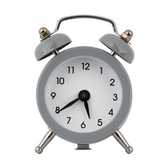 A gray clock with an alarm clock on a white background shows with arrows the time is five hours forty minutes or seventeen hours forty minutes