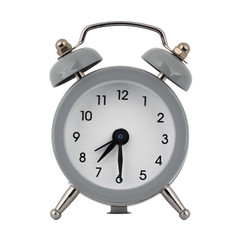 A gray clock with an alarm clock on a white background with arrows showing the time seven hours thirty minutes or nineteen hours thirty minutes