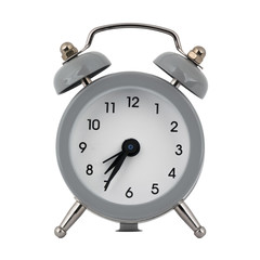 A gray clock with an alarm clock on a white background with arrows showing the time seven hours thirty five minutes or nineteen hours thirty five minutes
