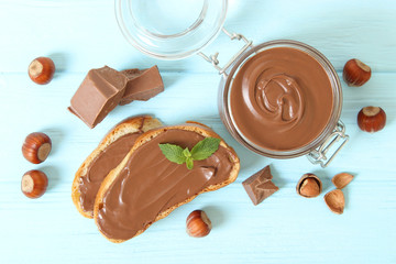 Toast with chocolate paste on the table.