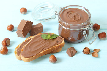 Toast with chocolate paste on the table.