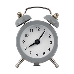 A gray clock with an alarm clock on a white background with arrows showing the time eight hours five minutes or twenty hours five minutes