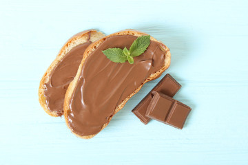 Toast with chocolate paste on the table.