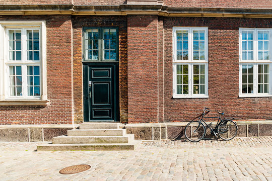 Exterior architecture. Vintage bicycles in front of brick facace in Copenhagen, Denmark