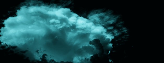 Obraz na płótnie Canvas Big dramatic storm cloud (probably cumulonimbus) at summer twylight beside small moon (on the right side)