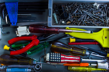 Closeup tools various in opened toolbox. View from above.