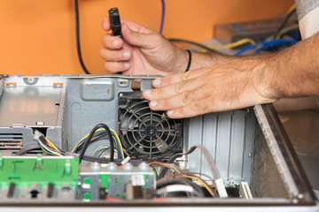 Technician repairing the computer. Concept of computer hardware, repairing, upgrade and technology .