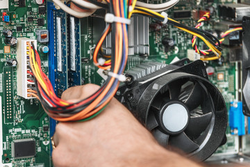 Technician repairing the computer, close up. Concept of computer hardware, repairing, upgrade and...