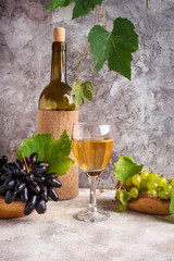 Fototapeta premium Grape, bottle and glass of white wine