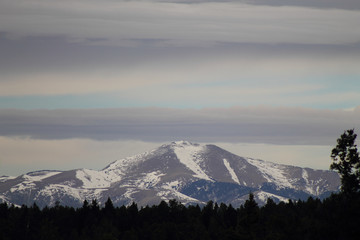 Fototapeta na wymiar Winter Skies over Sierra Blanca Peak in New Mexico