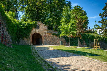 Fototapeta na wymiar Main entrance to the Spilberk castle, defensive walls from the park side.