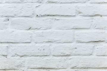 Dirty White brick wall as background or cover.