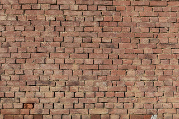 Old orange or red brick wall as background or texture. Big brick wall.Old orange or red brick wall as background or texture. Big brick wall.