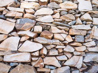 Old stone wall, texture background, natural color on the sunny day.