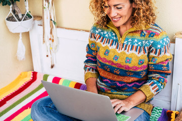 full of color image for middle age woman working freedom at laptop outdoor in the terrace, plants and nature in the background for independence concept - cheerful people worker with technology