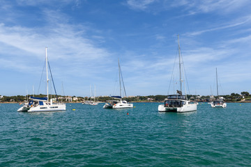 Obraz premium Yachts in the port of Portocolom located in the southeast at the coast of Majorca. Spain