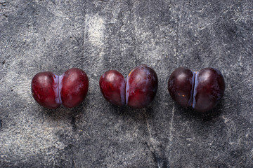 Ugly plums. Abnormal organic fruit
