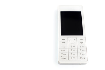 An old mobile phone with a black display on a white background