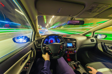 The movement of the car at speed. Blurred background view of the car dashboard.