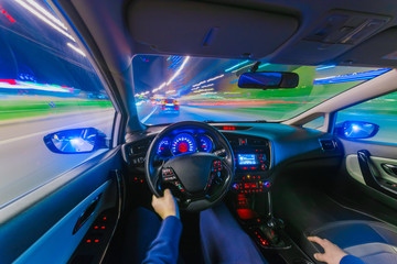The movement of the car at speed. Blurred background view of the car dashboard.