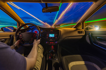 The movement of the car at speed. Blurred background view of the car dashboard.