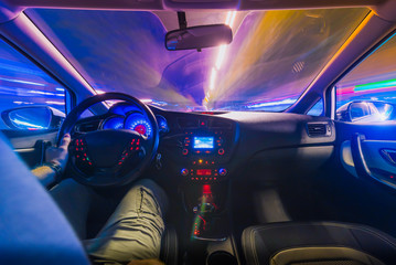 The movement of the car at speed. Blurred background view of the car dashboard.