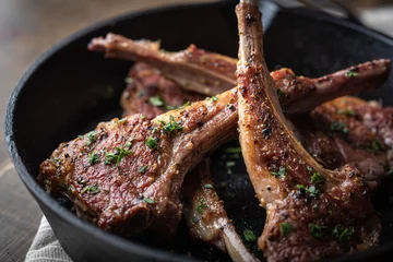 Fotobehang grilled lamb chop on cast iron pan © ahirao