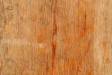 Wooden texture background. Old wood orange texture with different vertical lines and paint drips....