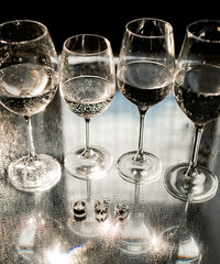 Glasses on the table. Festive table setting. Wedding decor. Table setting in fine art style,selective and soft focus