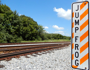 Jump frog sign near tracks