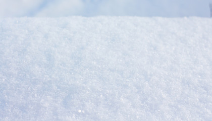 Texture of snow in sunny weather. Background - snow surface_