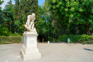 Obraz premium Wood Breaker marble statue at one of entrances to National Gardens Athens.