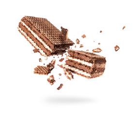 Chocolate waffles broken into two halves isolated on a white background
