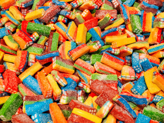 Colorful gummy candies. Top view, flat lay. Background of delicious sweets.