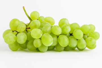 One bunch of ripe organic white grapes isolated on white background, side view