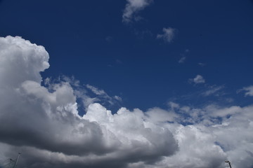 Naklejka na ściany i meble The blue sky and white clouds in September.