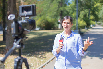 woman reporter reporting from field