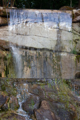 Beautiful nature waterfall on a small lake
