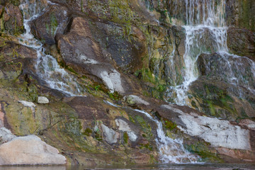 Beautiful nature waterfall on a small lake