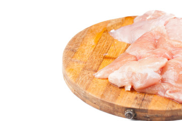 Chicken steak on wooden cutting board isolated on white background