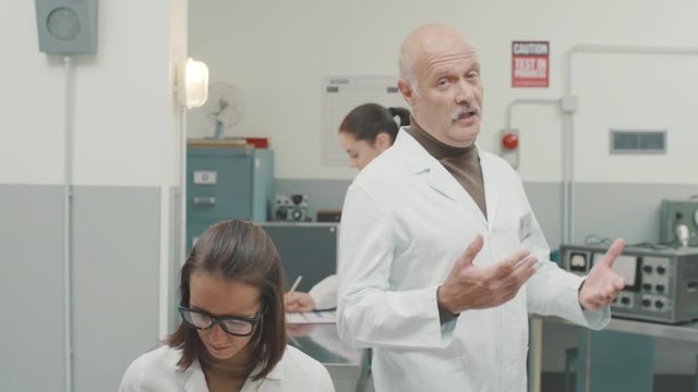 Scientist standing in the laboratory and giving a speech