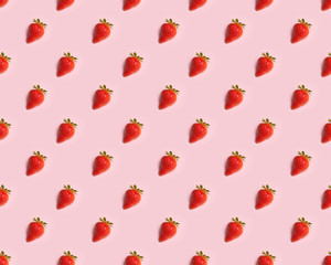 ripe strawberries on a pink background