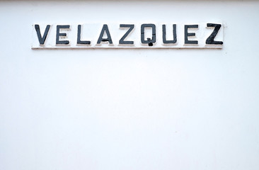 Velazquez black name on white background.